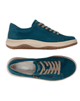 Pair of teal suede sneakers with a side zipper, beige laces, grey accent stitching, cream midsole, and a brown tan outsole.