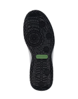 Black geometric textured outsole with green Remonte logo stamped in middle.