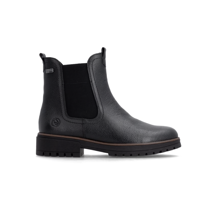 A black pebbled leather Chelsea boot with a black elastic side panel and a chunky black lug outsole.
