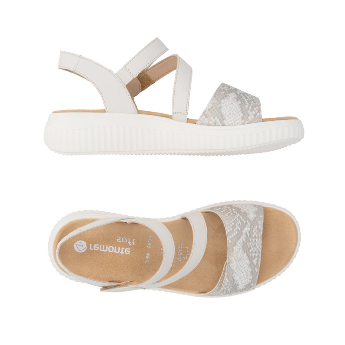 Pair of White backstrap sandals with Velcro  split strap, snake print  strap, tan Remonte logo'd footbed, and thick ribbed white outsole.