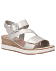 Gold backstrap wedge sandal with three velcro straps, decorative silver buckle, white and wood grain midsole and Remonte logo'd tan footbed.
