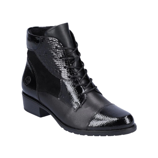 Lace-up leather boot in black with patent accents and a low heel.