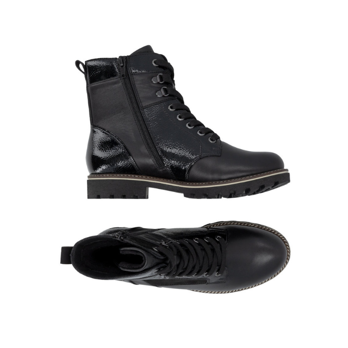 Pair of black lace-up ankle boots with black laces, black metal eyelets, inside zipper, suede and patent accents and a black lug outsole.