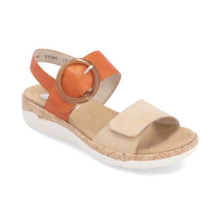 Rieker R6853 Backstrap Sandal in tan and orange with large round buckle, designed for comfort, flexibility, and summer style.