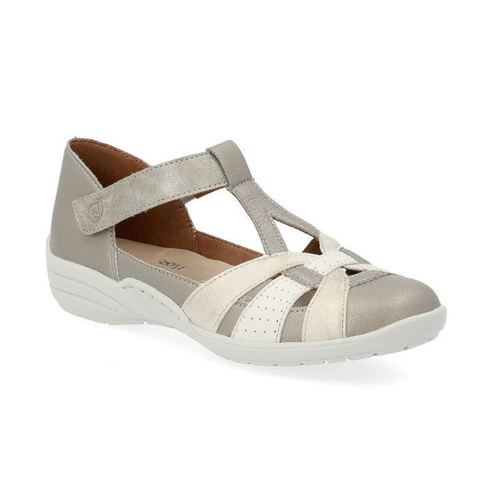 Women's Rieker R7601 Mary-Jane Shoe in beige with Velcro strap, flexible sole, and breathable leather design for casual comfort.