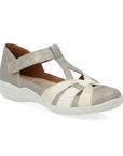 Women's Rieker R7601 Mary-Jane Shoe in beige with Velcro strap, flexible sole, and breathable leather design for casual comfort.