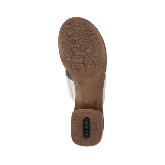 Brown wavey pattern tread and green Remonte logo on block heel outsole.