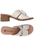 Pair of Beige sandals with beige bow, tan Remonte logo'd footbed and brown wood grain block heel.
