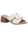 Beige sandal with beige bow, tan Remonte logo'd footbed and brown wood grain block heel.
