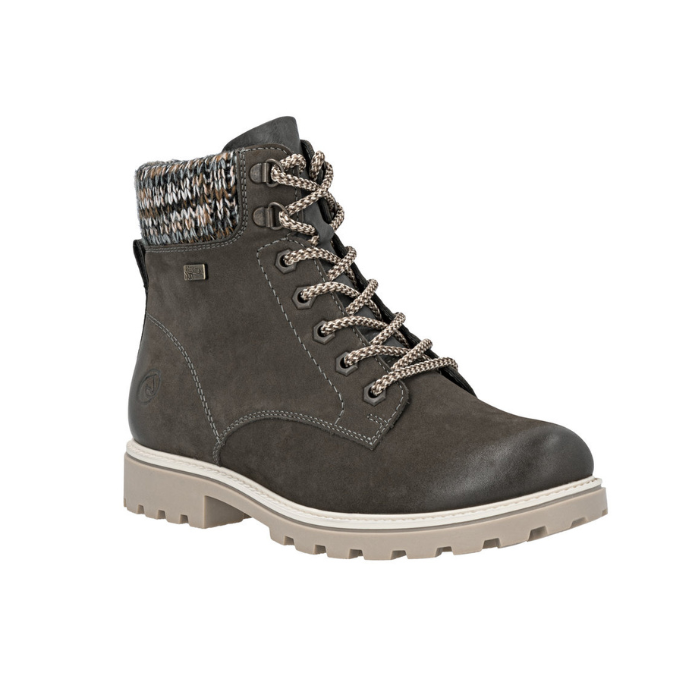Grey lace up winter combat boot with brown knit cuff and tan rugged outsole.