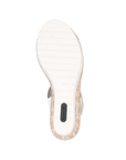 White light treaded outsole with green Remonte logo on heel.