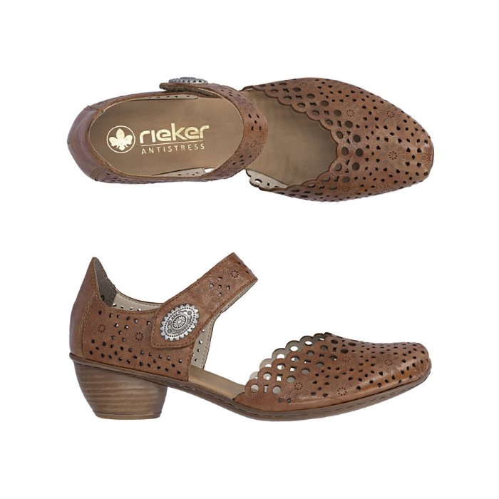 Pair of brown heeled open sided Mary-Janes with Velcro ankle strap, floral pattern, decorative perforations and a low stacked heel.
