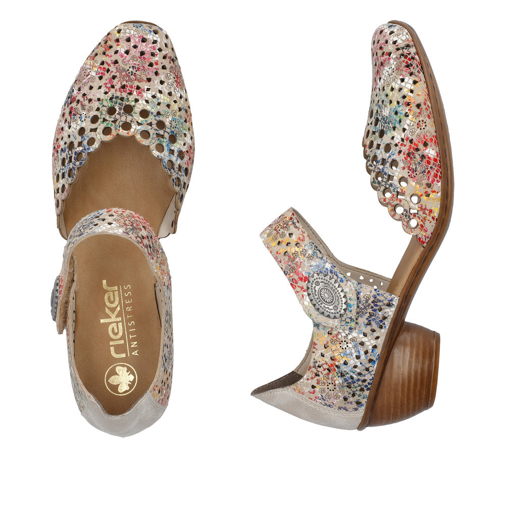 Pair of multicolord heeled open sided Mary-Janes with Velcro ankle strap, floral pattern, decorative perforations and a low stacked heel.