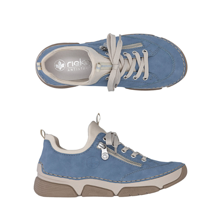Pair of light blue sneakers with faux side zipper, white Rieker logo'd footbed, accent stitching above the thick white midsole and beige outsole.