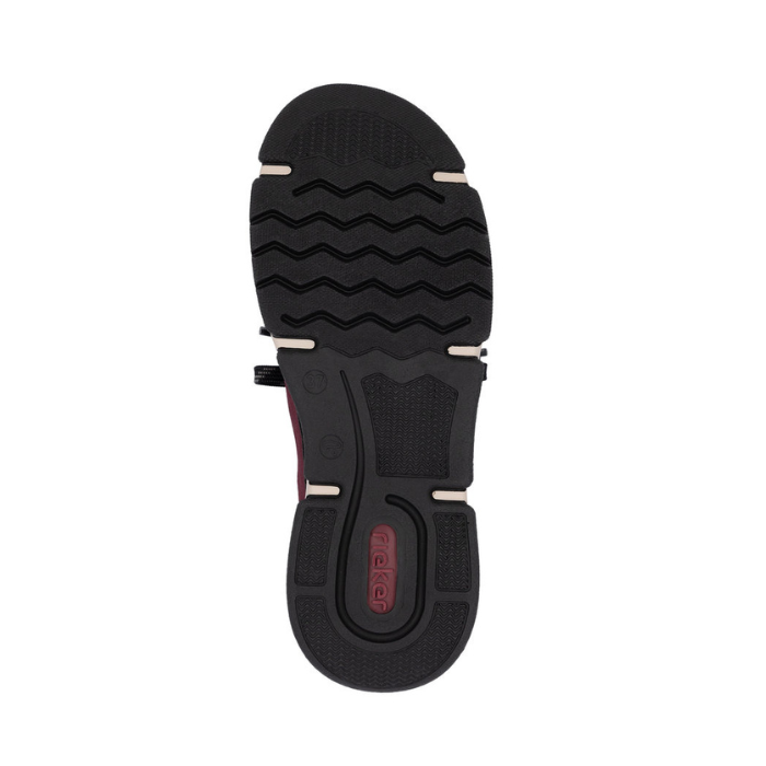 Black wave treaded outsole with red Rieker logo on heel.
