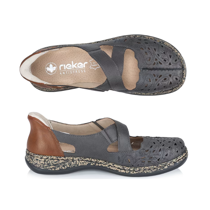 Pair of grey Mary-Janes with crisscross straps, brown heel cap, floral details around perforations, tan Rieker logo'd footbed and a marbled black/tan midsole.