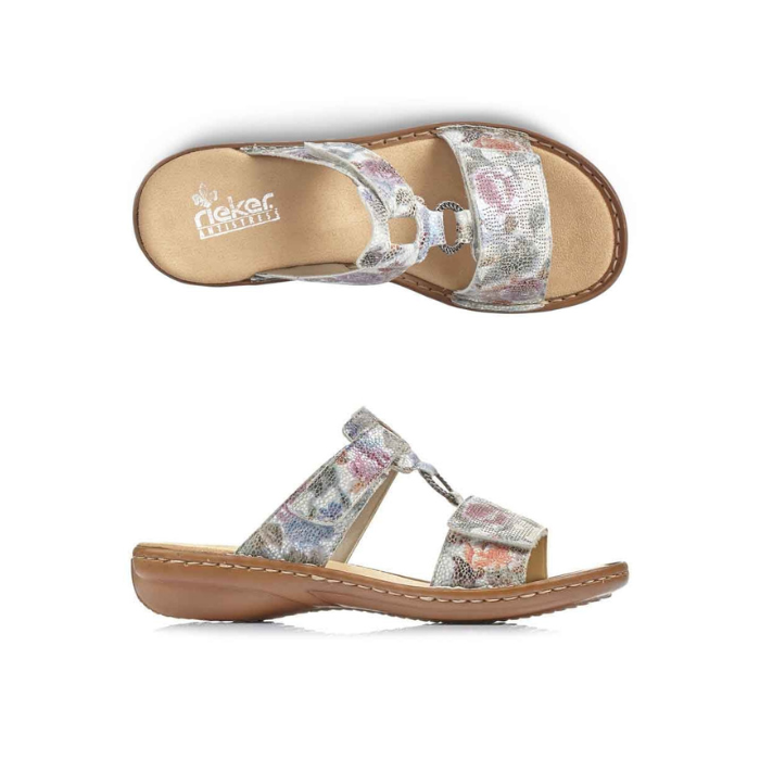 Pair of Pale floral print slide sandals with two Velcro straps, textured details and medallion accent, tan Rieker logo'd footbed and brown outsole.