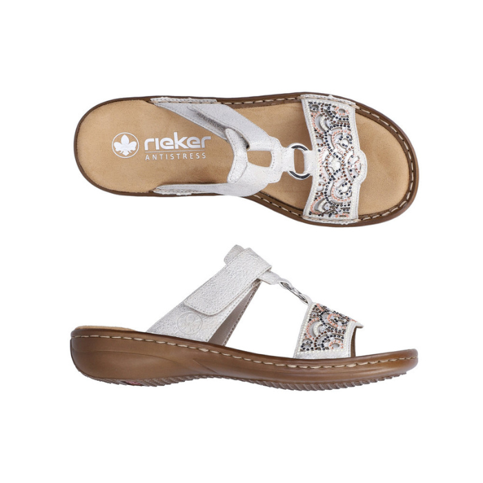 Pair of Slide Sandals in silver with decorative beading, Velcro strap, decorative ring medallion, tan Rieker logo'd footbed and brown outsole.