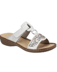Slide Sandal in silver with decorative beading, Velcro strap, decorative ring medallion, tan Rieker logo'd footbed and brown outsole.