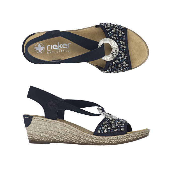 Pair of Navy slingback wedge sandals with  beaded embellishments, silver medallion, faux espadrille midsole and a tan Rieker logo'd footbed.