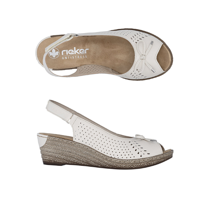 Pair of white wedge slingback peep toe sandals with perforated upper, small decorative bow on vamp, tan Rieker logo'd footbed, faux espadrille midsole and a brown outsole.