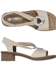 Pair of beige slingback leather sandal with metallic medallion, tan Rieker logo'd footbed and low block heel.