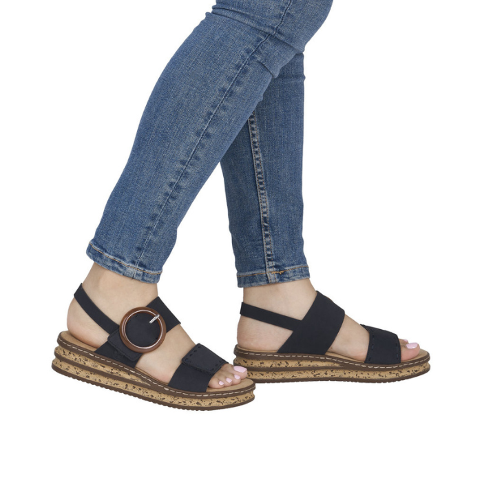 Navy backstrap sandals with faux cork midsole worn with blue jeans.
