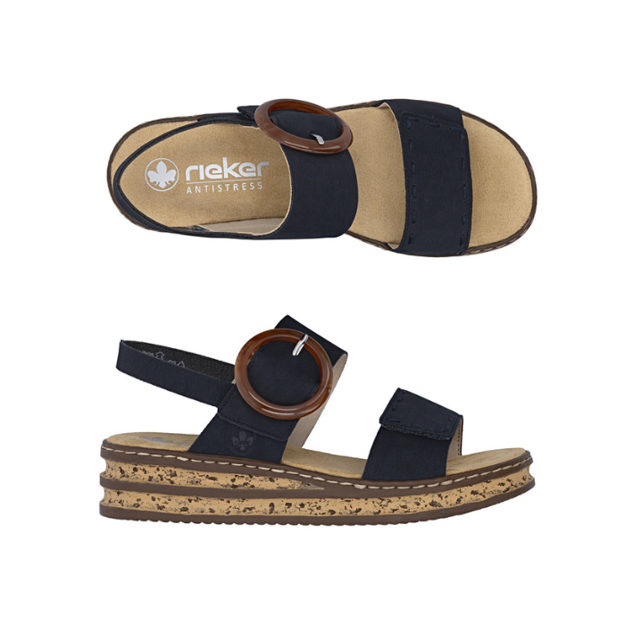 Pair of Navy Backstrap Sandals with a stylish circle buckle, two Velcro straps, tan Rieker logo'd footbed, faux cork layered midsole and black outsole.
