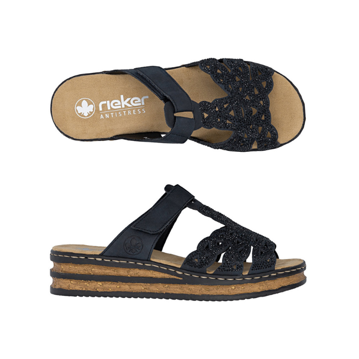 Pair of Navy slide sandals with sparkly upper, Velcro strap across vamp, tan Rieker logo'd footbed, and faux cord midsole.