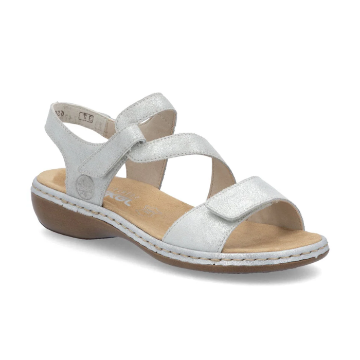 Silver metallic Rieker 659C7 women&#39;s sandal with Velcro straps and cushioned insole for stylish, supportive wear.