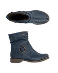 Pair of navy blue slouchy ankle boots with a brown sole, inside zipper and a bronze circular metal ring detail on the side.