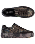 Pair of low-top platform sneakers with dark brown accents, dark brown laces, and a deep purple and brown floral camouflage pattern on the upper and midsole.