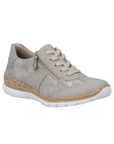 Soft beige sneaker with shimmery accent panels, lace, side zipper, faux cork midsole and white outsole.