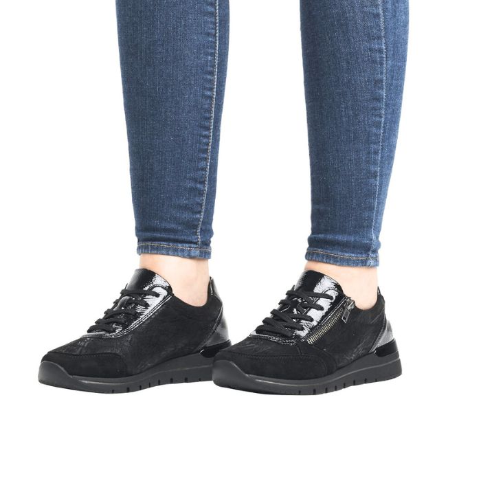 Grey lace up sneaker with low wedge outsole and side zipper closure.
