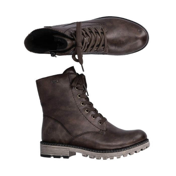 Brown leather combat boot with light brown outsole.