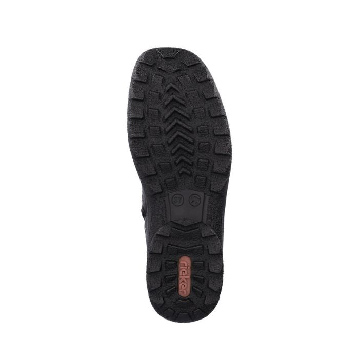 Black outsole of women&#39;s boot with red Rieker logo on heel.
