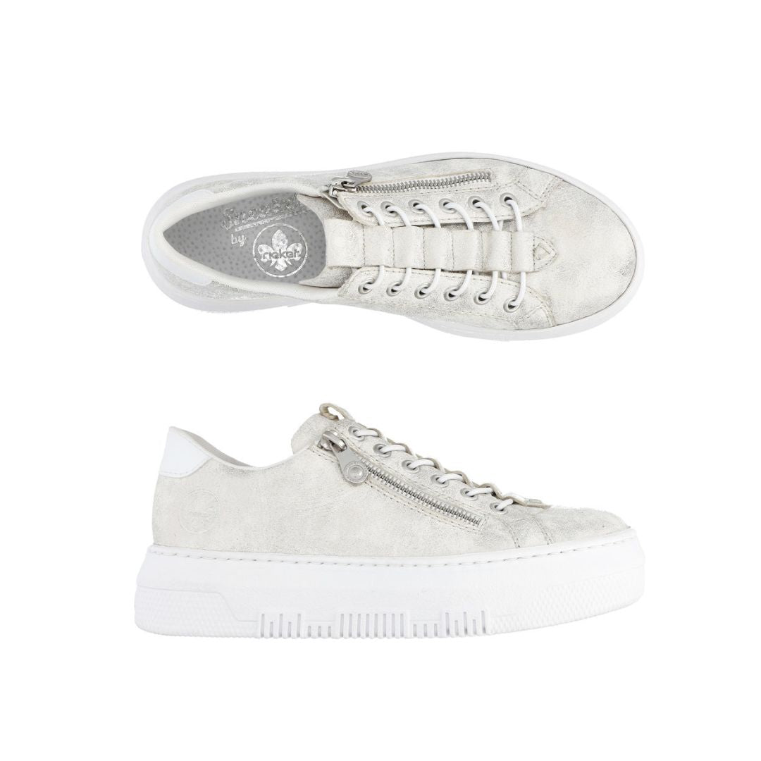 Pair of gold M1953 platform sneakers feature side zippers, thick soles, and cushioning.