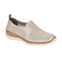 Beige perorated slip-on shoe with faux cork midsole and white outsole.