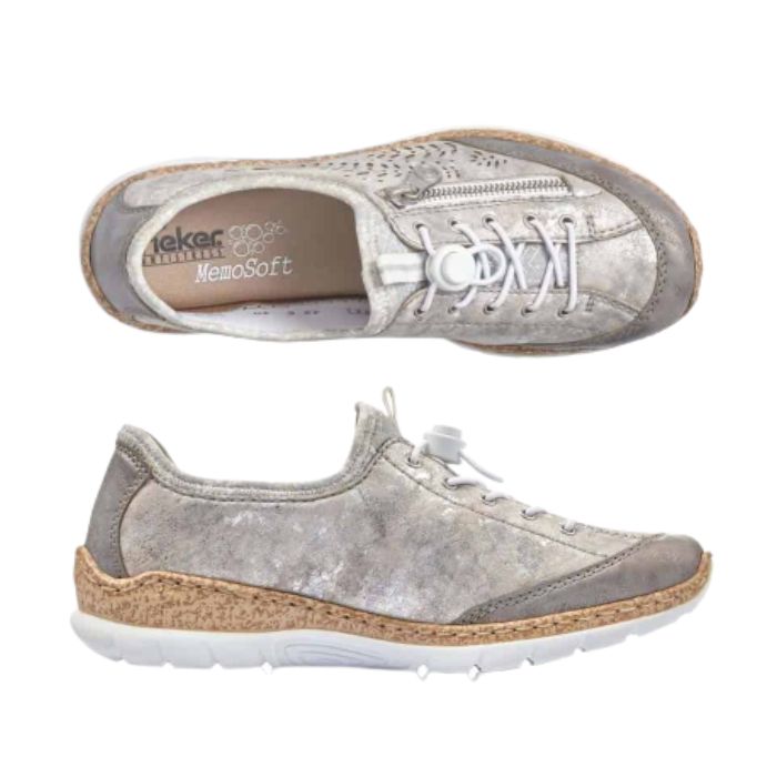 Silver slip on sneaker with white bungee lace with toggle. These have a cork midsole and white outsole. Rieker logo on heel of brown memory foam insole.