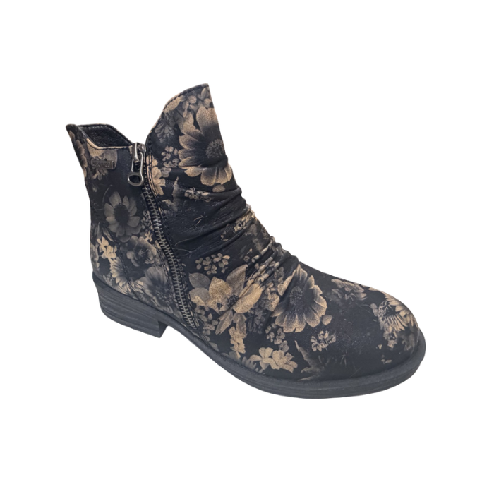 A single ankle boot with a dark charcoal gray base and a beige floral pattern, featuring a side zipper and a low block heel.