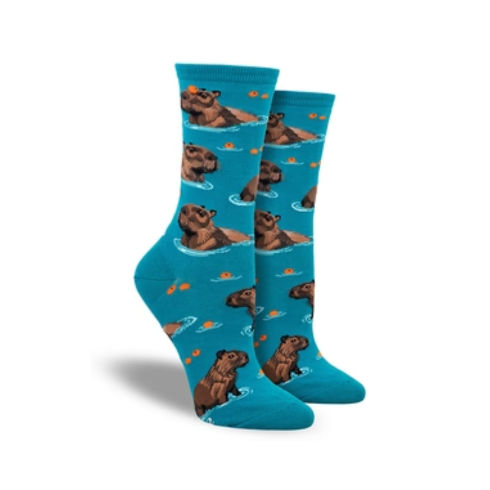 Women's crew socks in teal featuring  capybaras swimming with oranges.