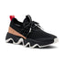 Women's Sorel Kinetic Impact Lace II Sneaker in black with tan accents and chunky white sole, designed for comfort and all-day wear.