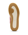 Tan gum outsole with light tread, cream center and Sorel logo stamped in middle.