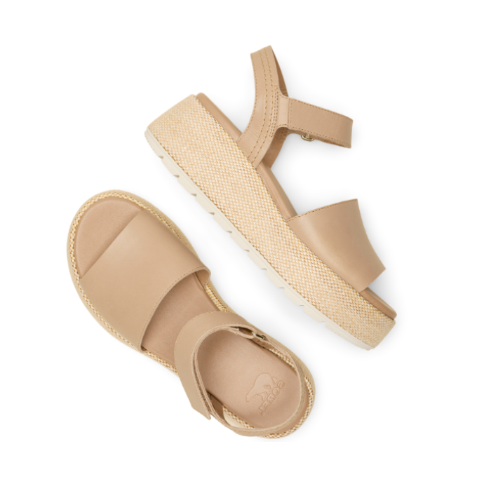 Pair of Beige backstrap sandals with a thick band over toe, Sorel logo'd footbed and a woven pattern platform sole.