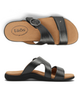 Pair of Pewter metallic slide sandals with two Velcro straps, detail buckle, beige Taos logo'd footbed and black outsole.