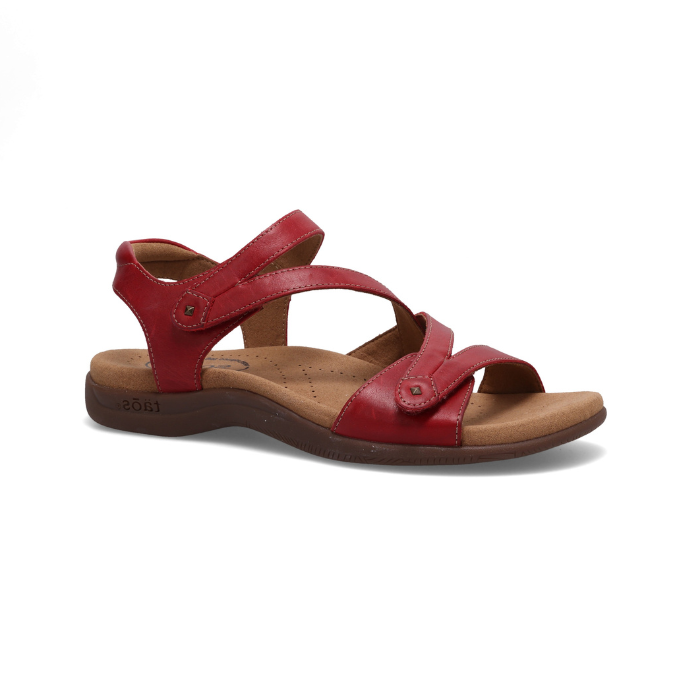 Red backstrap sandal with two Velcro cross straps, tan Taos logo'd footbed and dark brown outsole.
