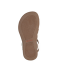 Leaf patterned tread on brown outsole with Taos logo stamped in middle.