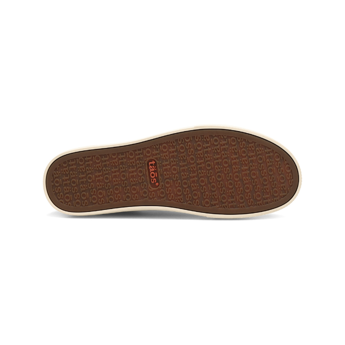 Brown outsole with "taos" word as repeating tread pattern of a sneaker.