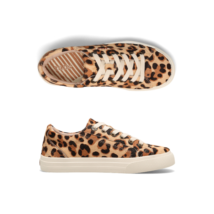 Pair of Leopard print pony hair sneakers with white laces, Taos logo'd footbed and a white thick rubber outsole.