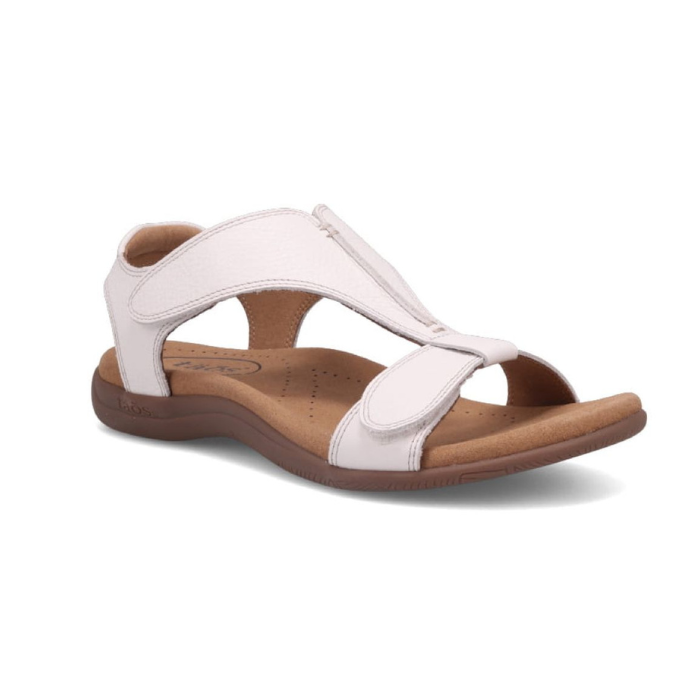 Backstrap leather sandal in white with two adjustable Velcro straps, t-strap design, tan Taos logo'd footbed and brown rubber outsole.
